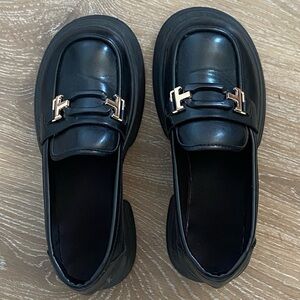 Elegant Black Loafers with Gold Accent